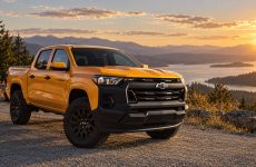 A Chevrolet Colorado crew-cab pickup at a scenic roadside turnout